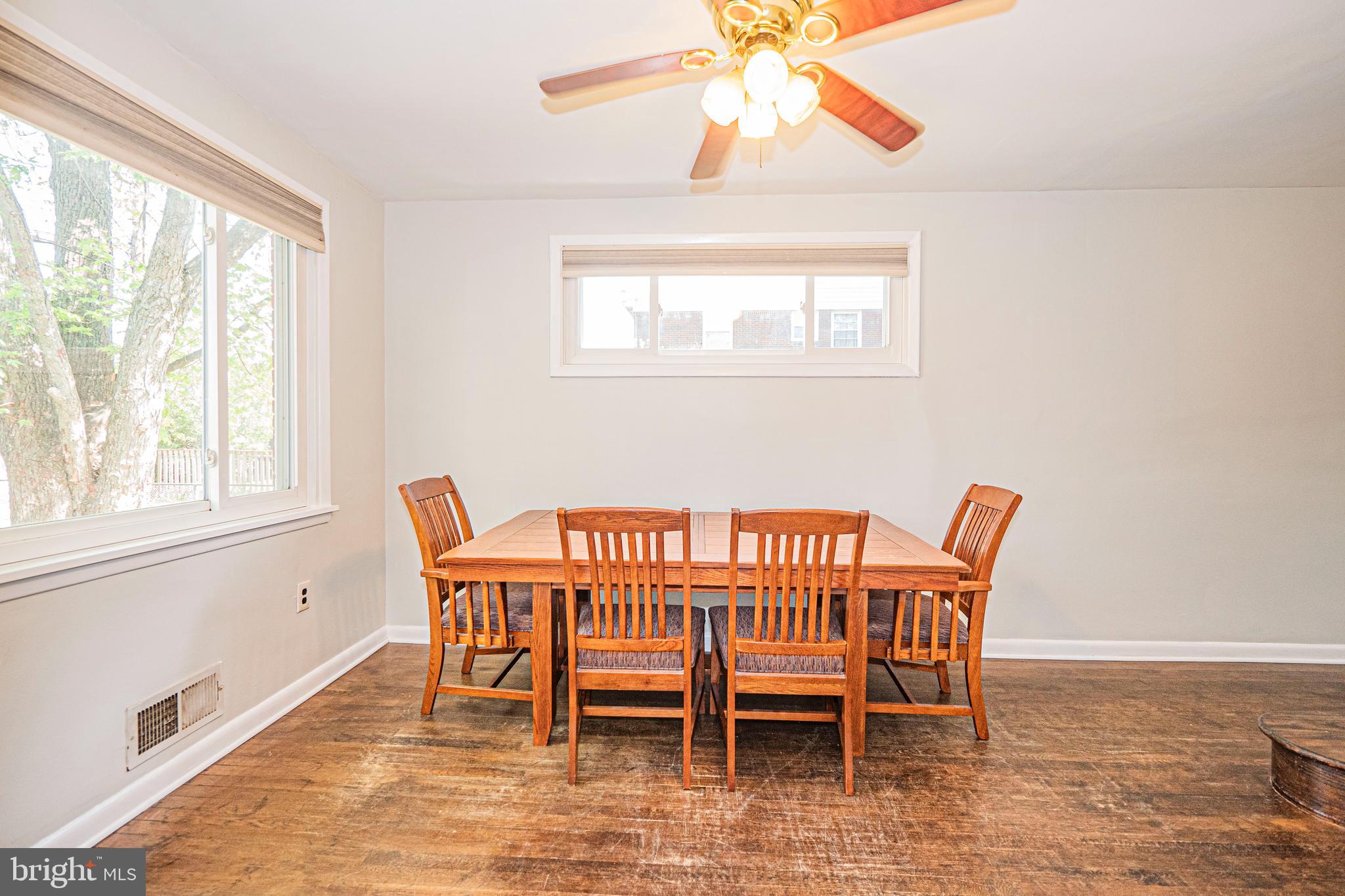 8501 Kings Ridge Road Baltimore, MD 21234 - Photo 7 of 37 a view of a dining room with furniture wooden floor and chandelier