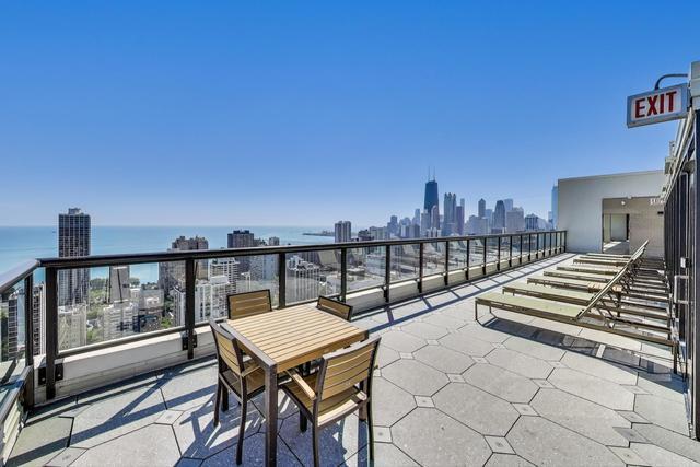 1560 North Sandburg Terrace, Unit 2007 Chicago, IL 60610 - Photo 23 of 25 a balcony with a city view