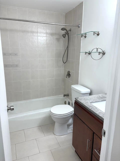 1560 North Sandburg Terrace, Unit 2007 Chicago, IL 60610 - Photo 9 of 25 a bathroom with a sink a toilet and shower