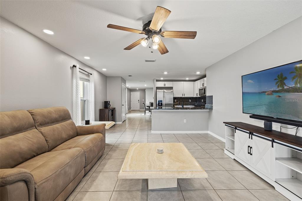 12115 Lily Magnolia Lane Riverview, FL 33569 - Photo 14 of 41 a living room with furniture and kitchen view