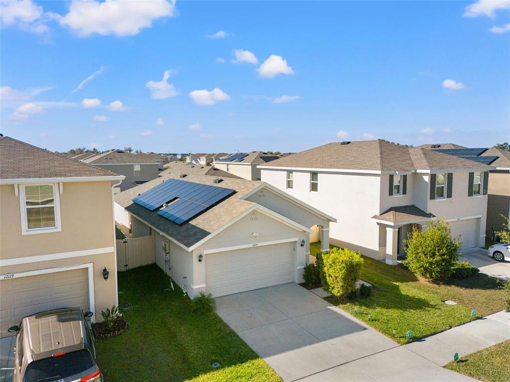 12115 Lily Magnolia Lane Riverview, FL 33569 - Photo 40 of 41 a view of a house with a yard