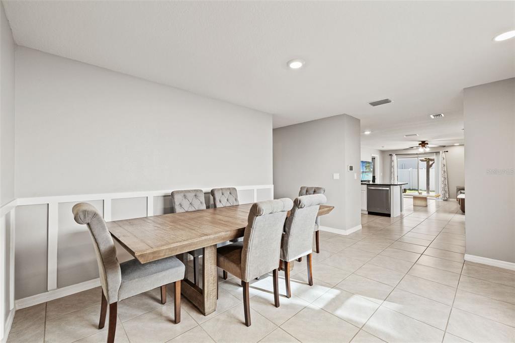 12115 Lily Magnolia Lane Riverview, FL 33569 - Photo 5 of 41 a view of a dining room with furniture