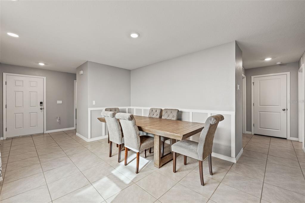 12115 Lily Magnolia Lane Riverview, FL 33569 - Photo 7 of 41 a view of a dining room with furniture