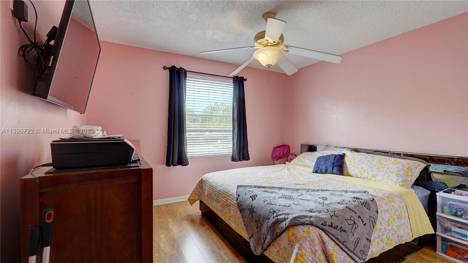 Silver Shores Miramar, FL 33027 - Photo 16 of 30 a bedroom with a bed and dresser with mirror