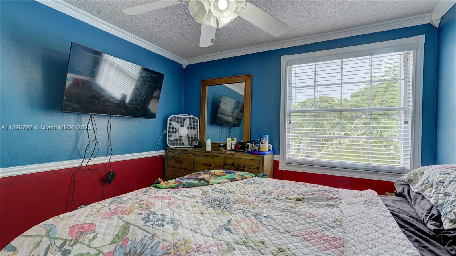 Silver Shores Miramar, FL 33027 - Photo 19 of 30 a bedroom with a bed and a flat screen tv