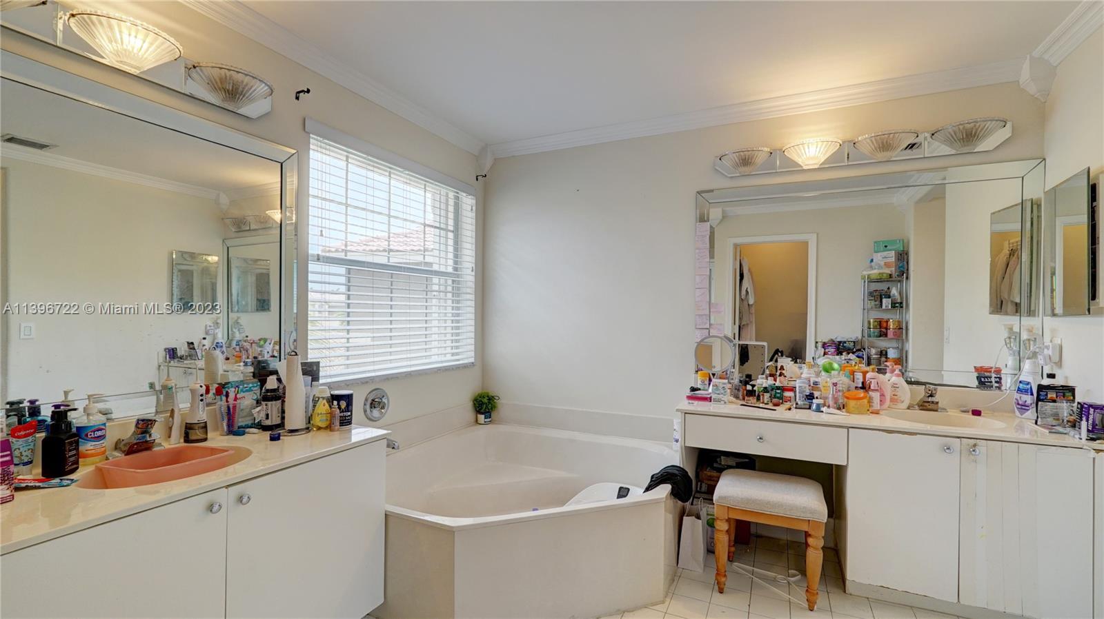 Silver Shores Miramar, FL 33027 - Photo 26 of 30 a bathroom with a sink mirror and a bathtub