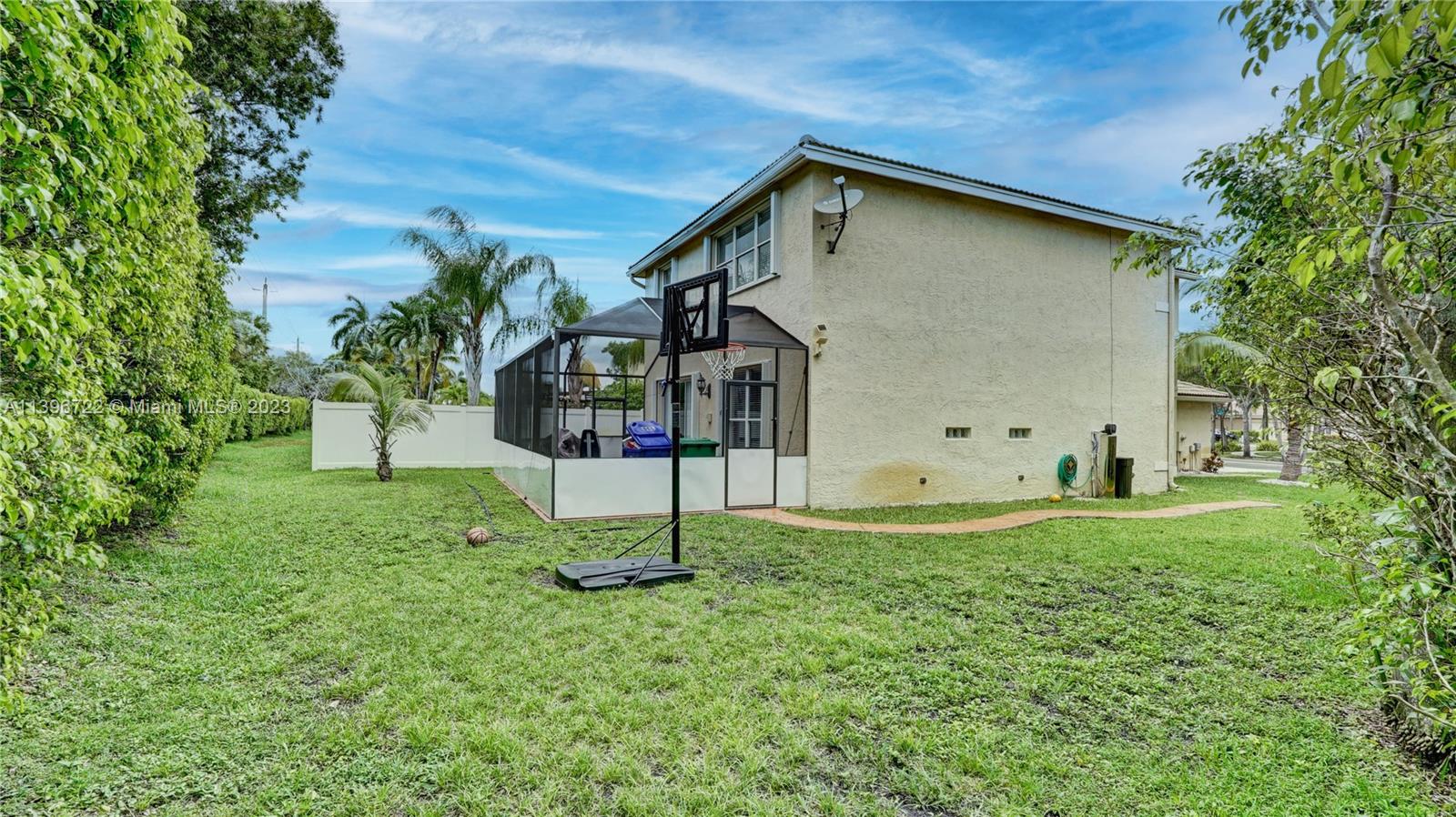 Silver Shores Miramar, FL 33027 - Photo 29 of 30 a house view with a garden space