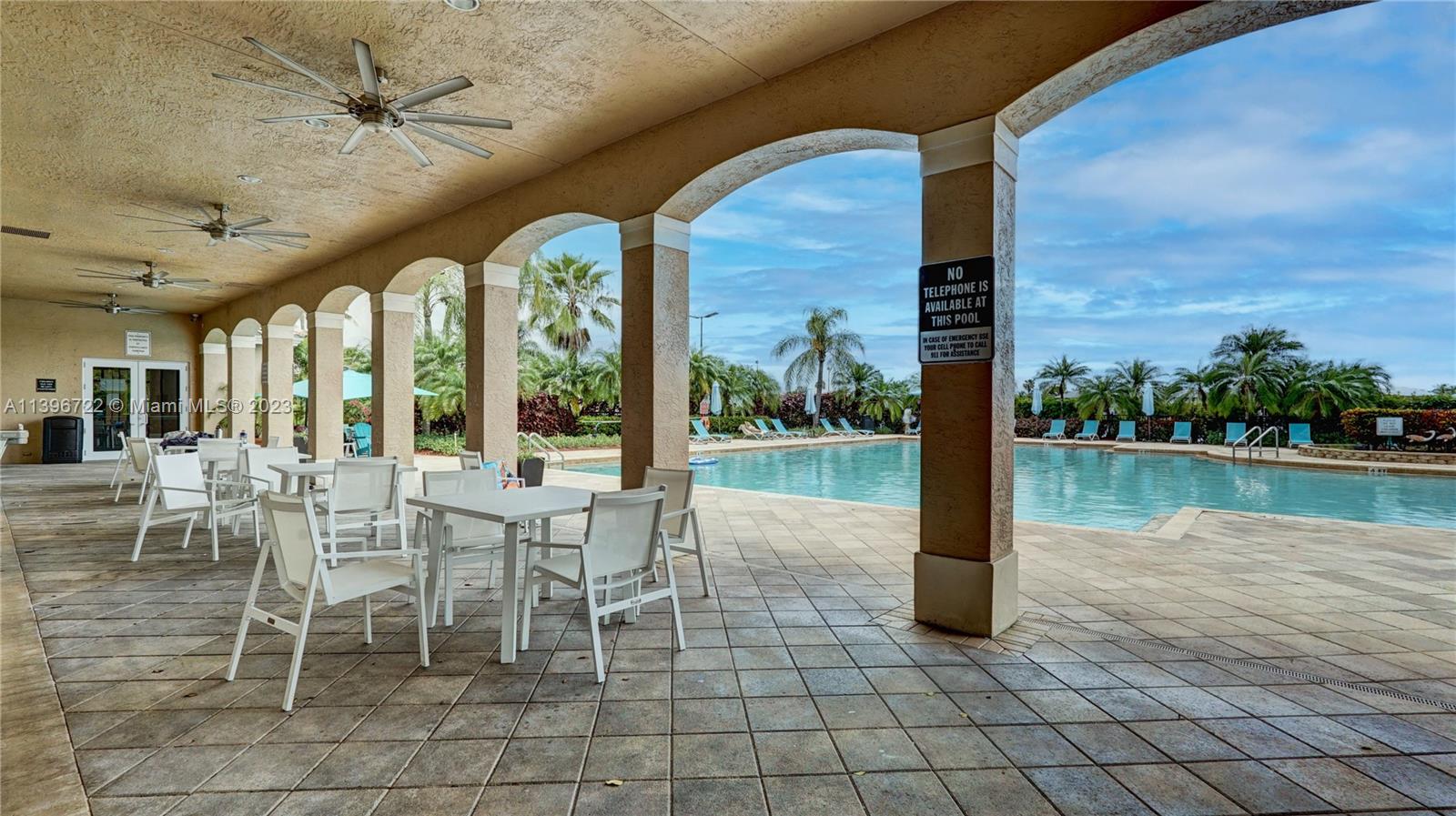 Silver Shores Miramar, FL 33027 - Photo 4 of 30 a dining room with garden view and a floor to ceiling window