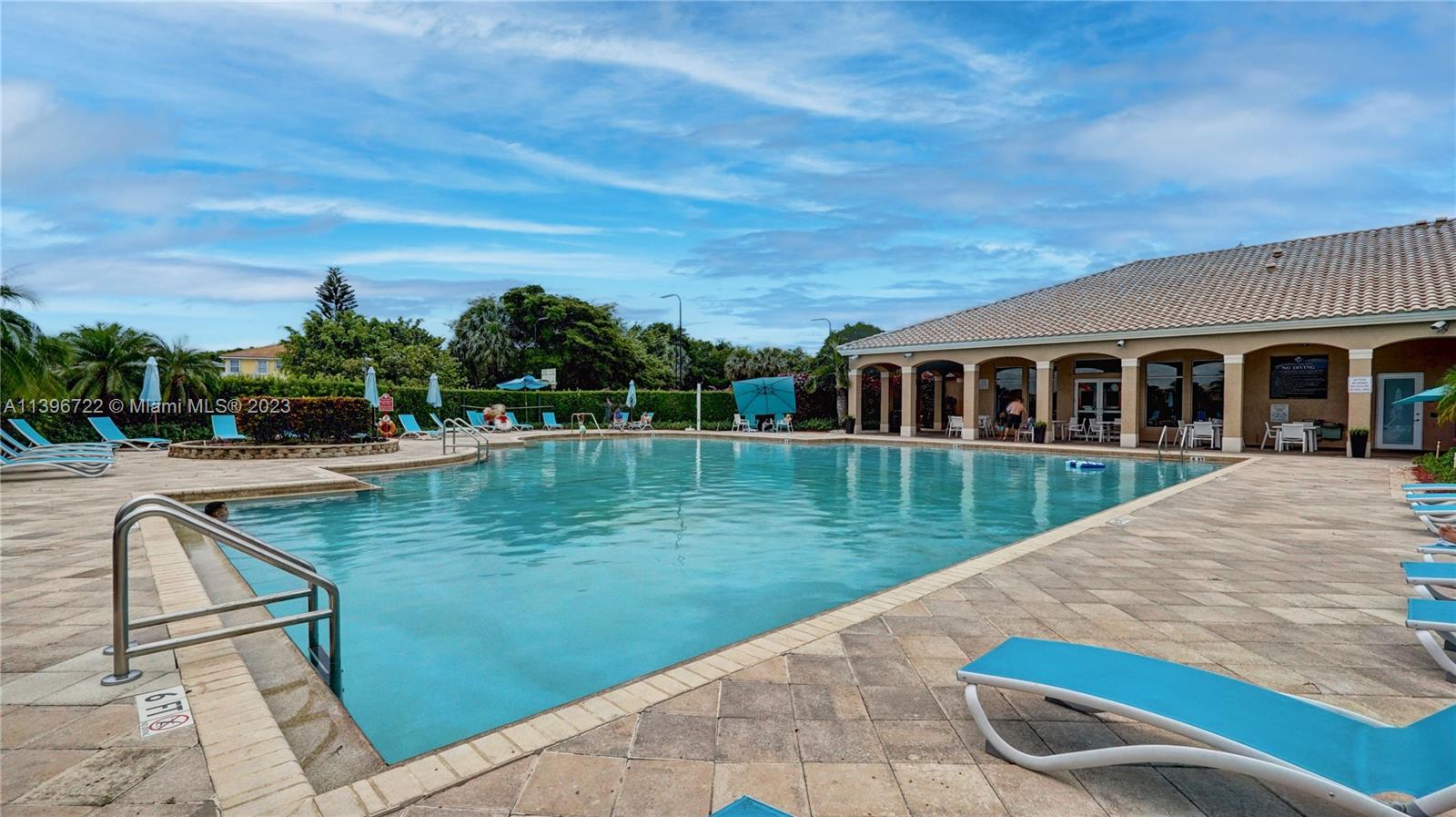 Silver Shores Miramar, FL 33027 - Photo 5 of 30 a view of swimming pool with a garden and trees