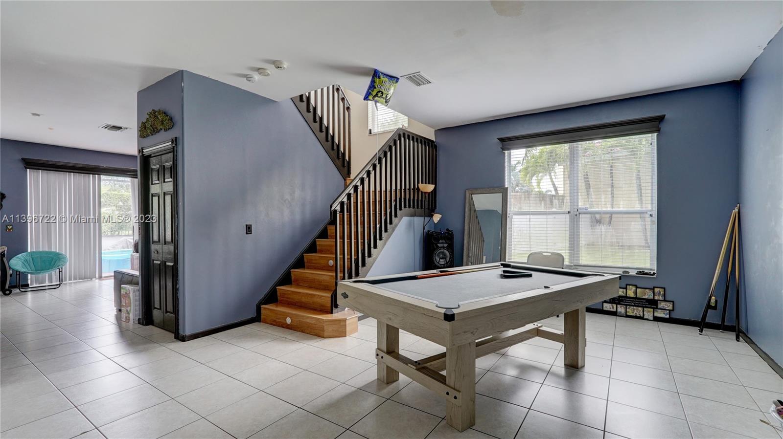 Silver Shores Miramar, FL 33027 - Photo 9 of 30 a view of a livingroom with furniture and staircase