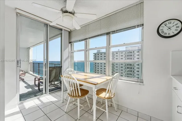 a view of a dining room with furniture window and outside view