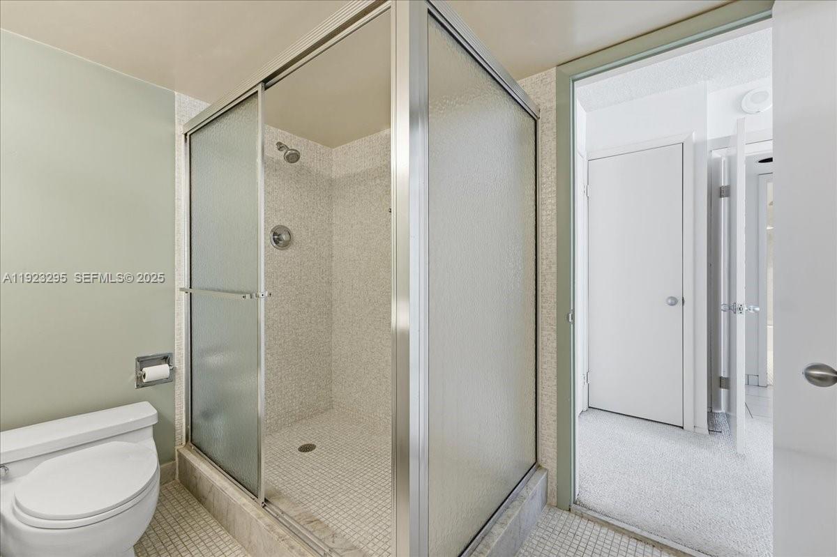 4280 Galt Ocean Drive, Unit 12H Fort Lauderdale, FL 33308 - Photo 16 of 31 a bathroom with a shower a toilet and sink