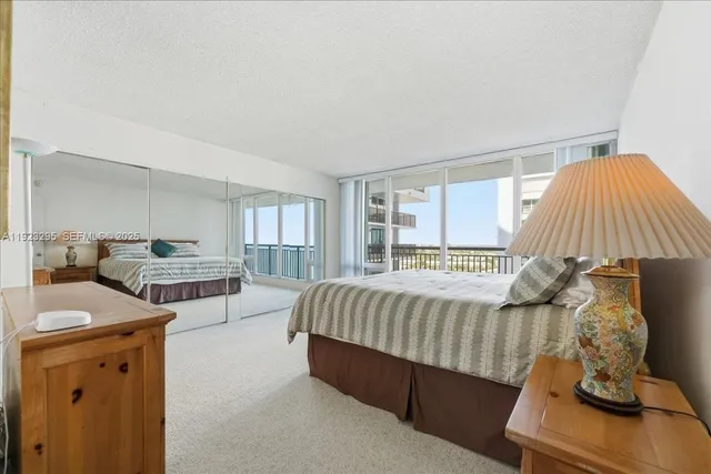 a bedroom with bed and window