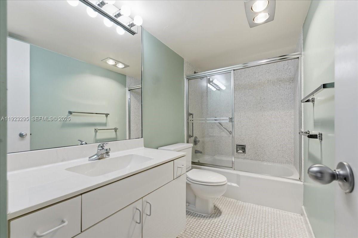 4280 Galt Ocean Drive, Unit 12H Fort Lauderdale, FL 33308 - Photo 22 of 31 a bathroom with a sink a toilet and shower