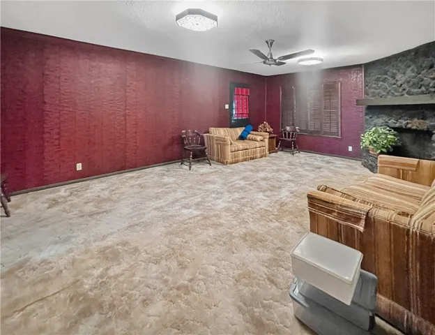 a room with furniture and a fireplace