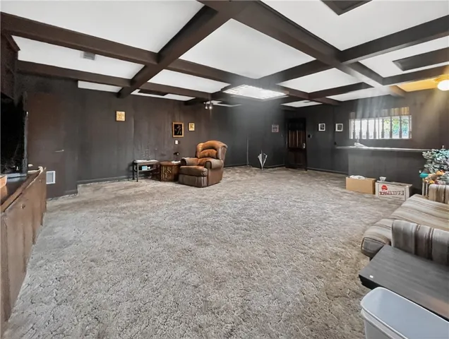 a view of a livingroom with furniture and a ceiling fan