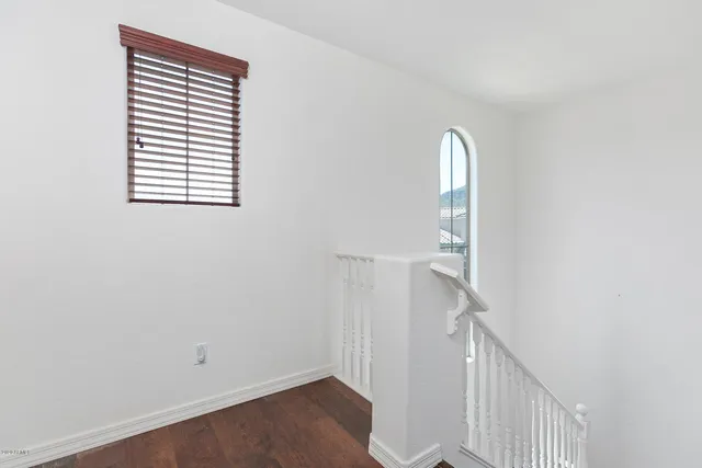 a view of a hallway with windows