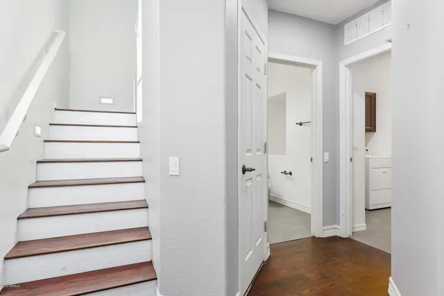 a view of entryway with bedroom and wooden floor