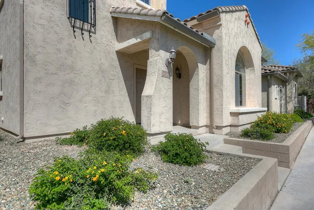 a front view of a house with garden