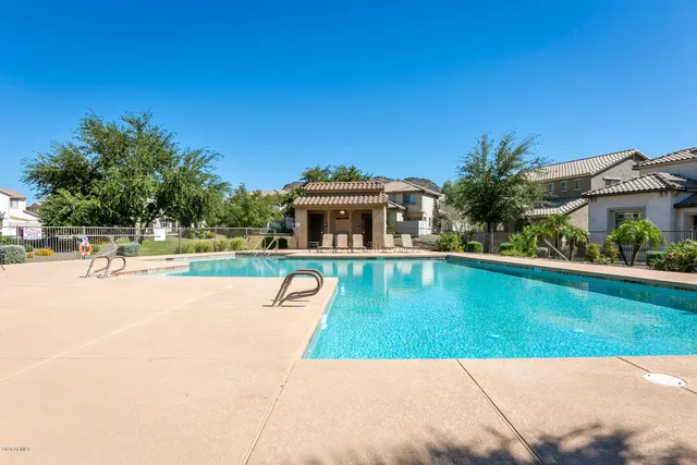a view of a swimming pool with a patio