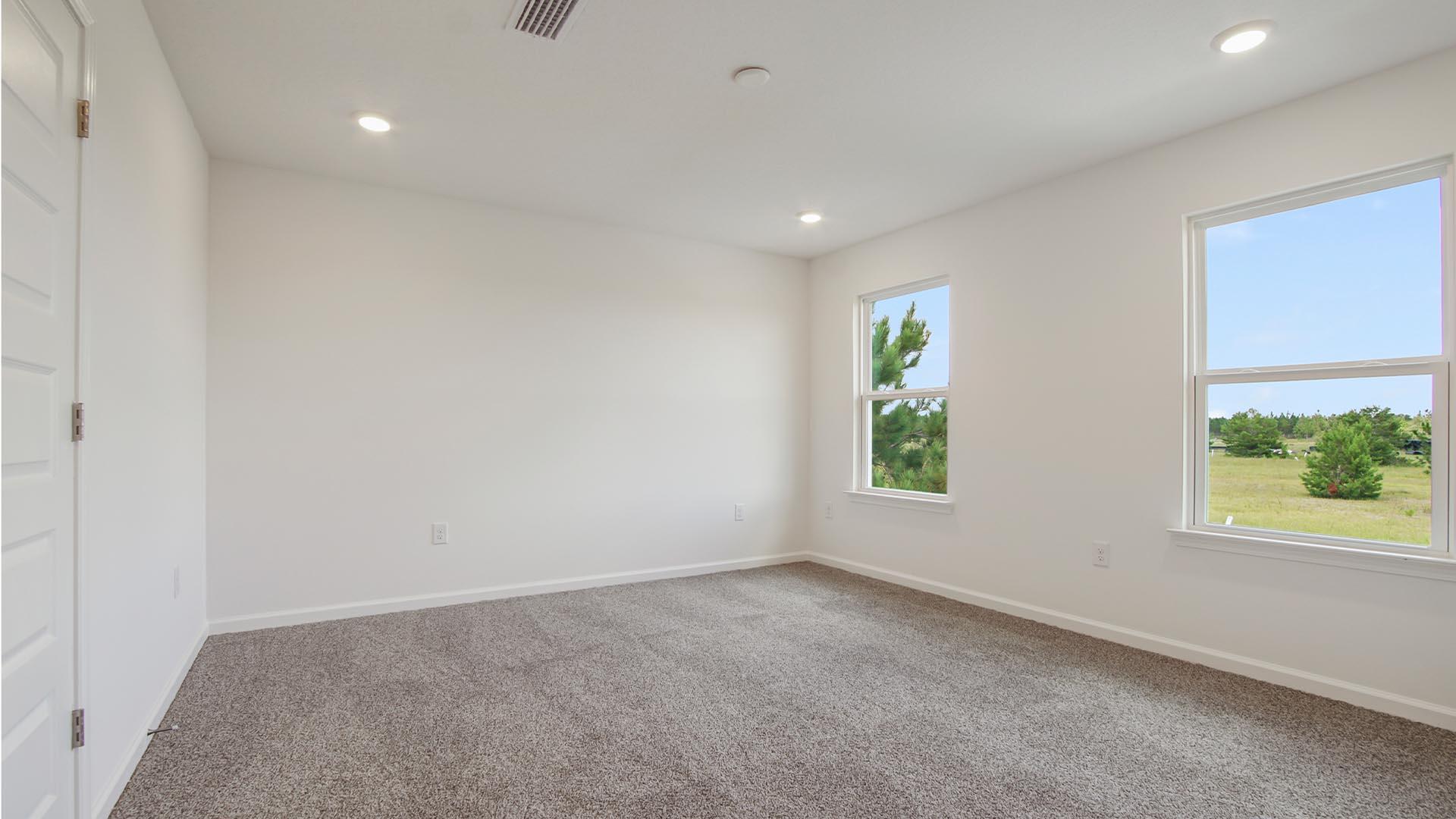 226 Huckleberry Street Freeport, FL 32439 - Photo 18 of 32 an empty room with windows