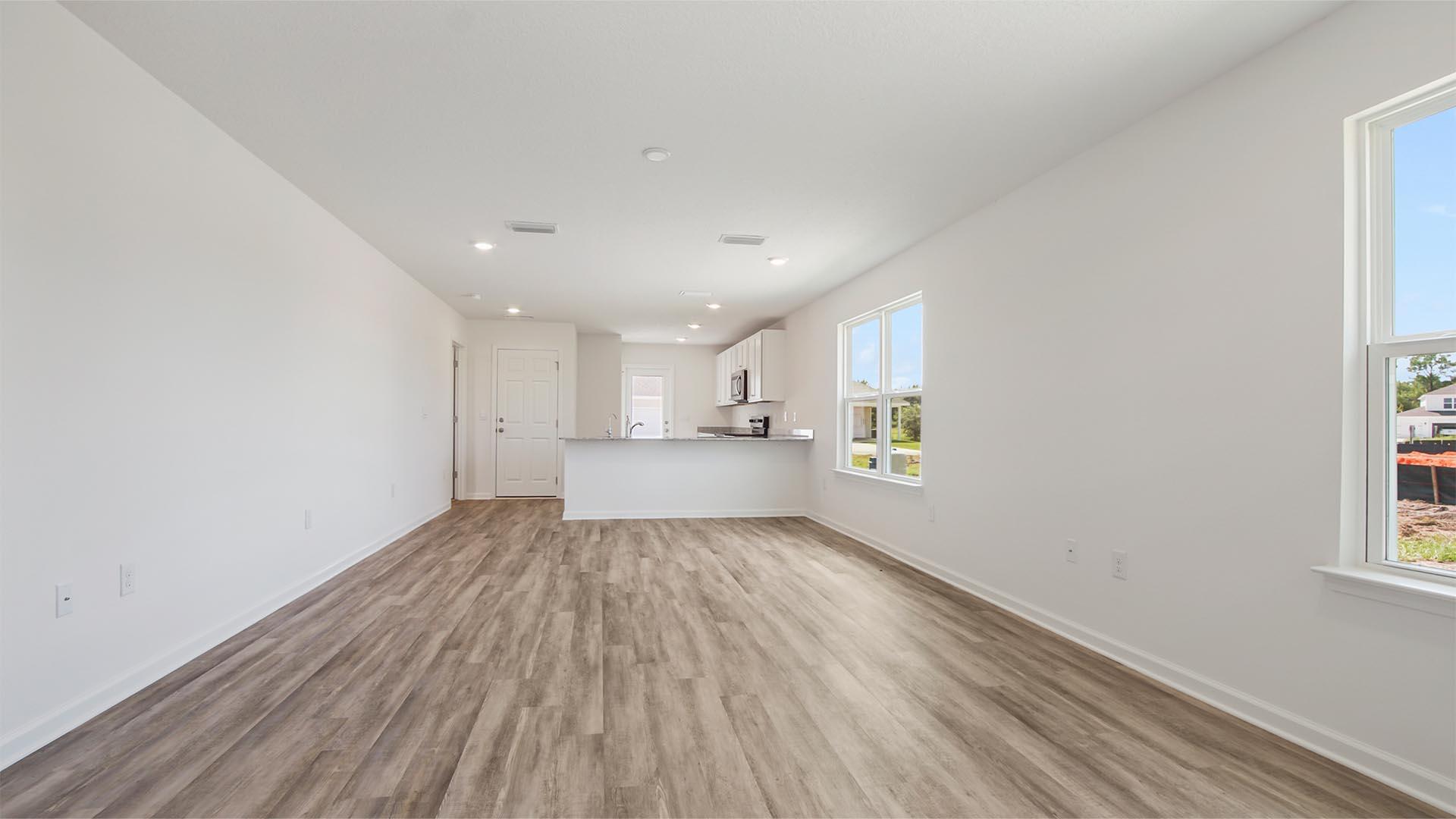 226 Huckleberry Street Freeport, FL 32439 - Photo 3 of 32 a view of a kitchen with wooden floor and windows