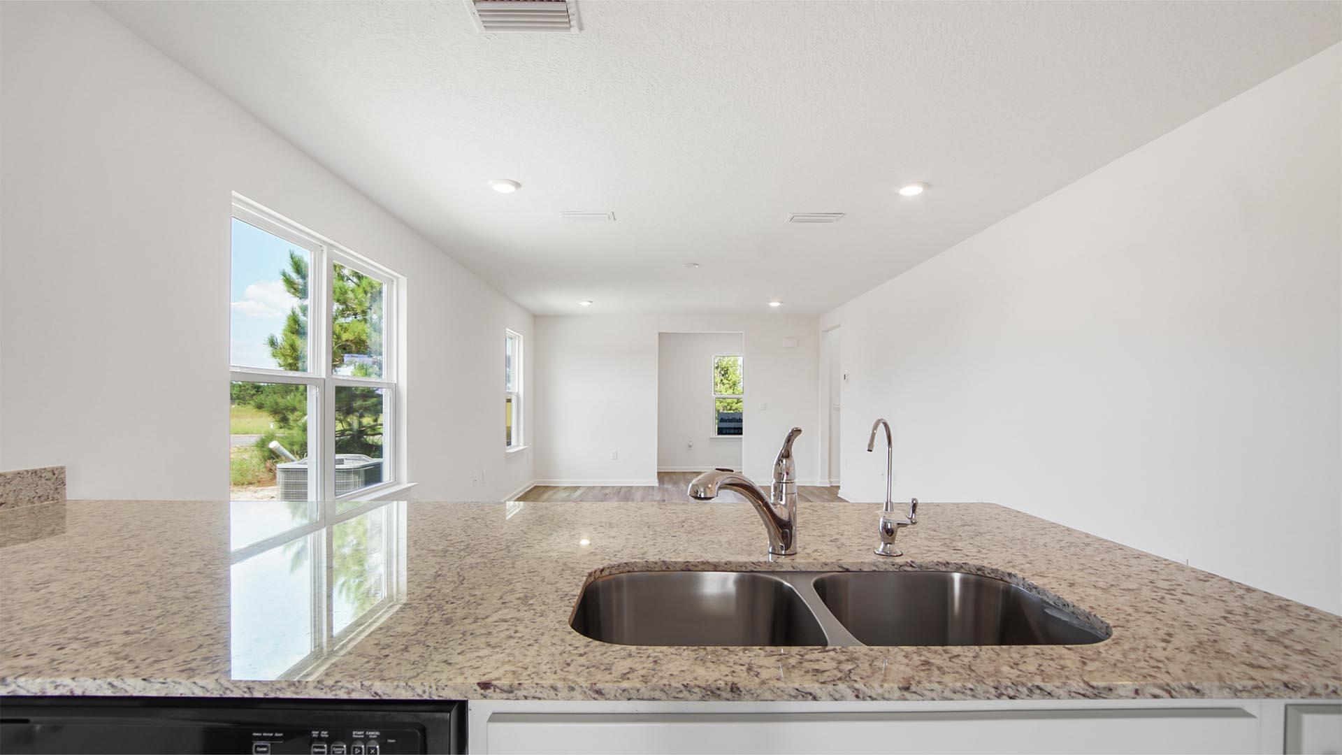 226 Huckleberry Street Freeport, FL 32439 - Photo 9 of 32 a kitchen with a sink and large window