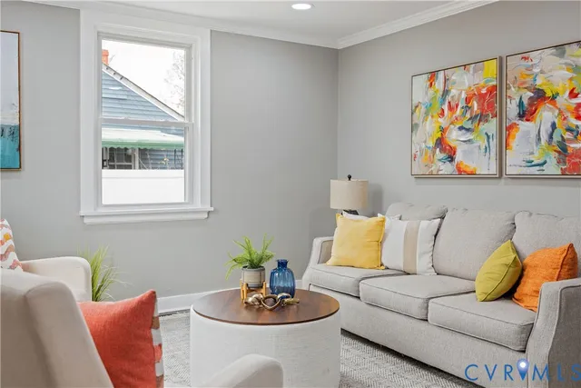 a living room with furniture and window