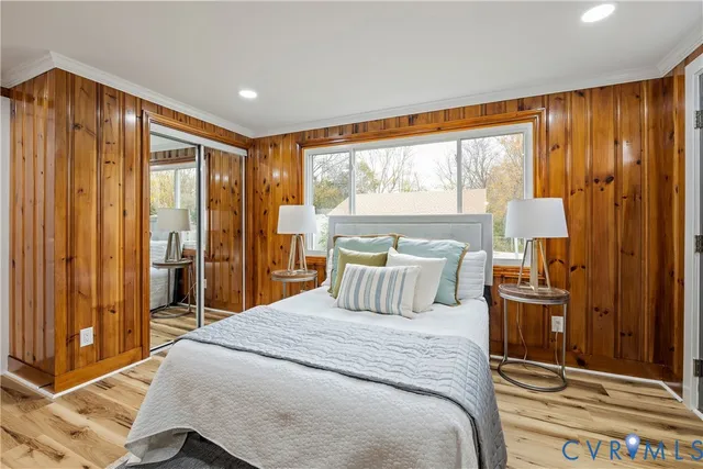 a bedroom with a large bed and a window