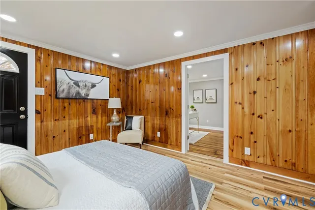 a bedroom with a bed and a view of bathroom