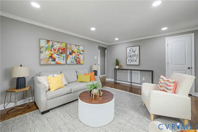 a living room with furniture and a painting