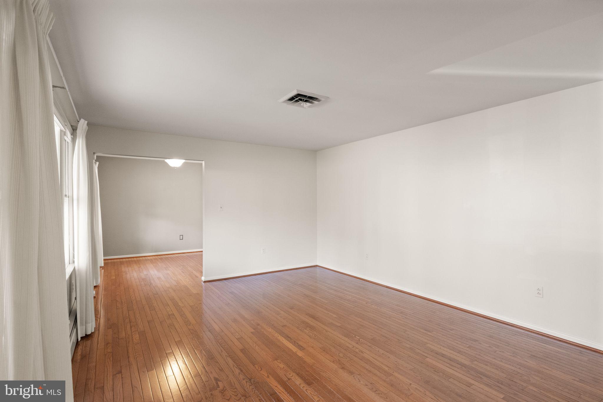 3801 Russell Road Woodbridge, VA 22192 - Photo 12 of 74 Formal living room with beautiful hardwoods.