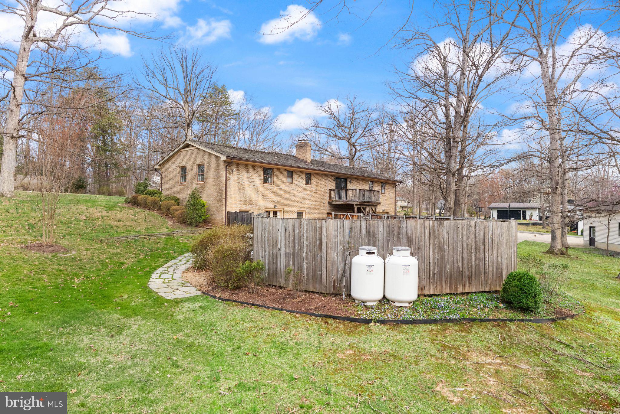 3801 Russell Road Woodbridge, VA 22192 - Photo 54 of 74 Pool fence and propane tanks for pool heaters.