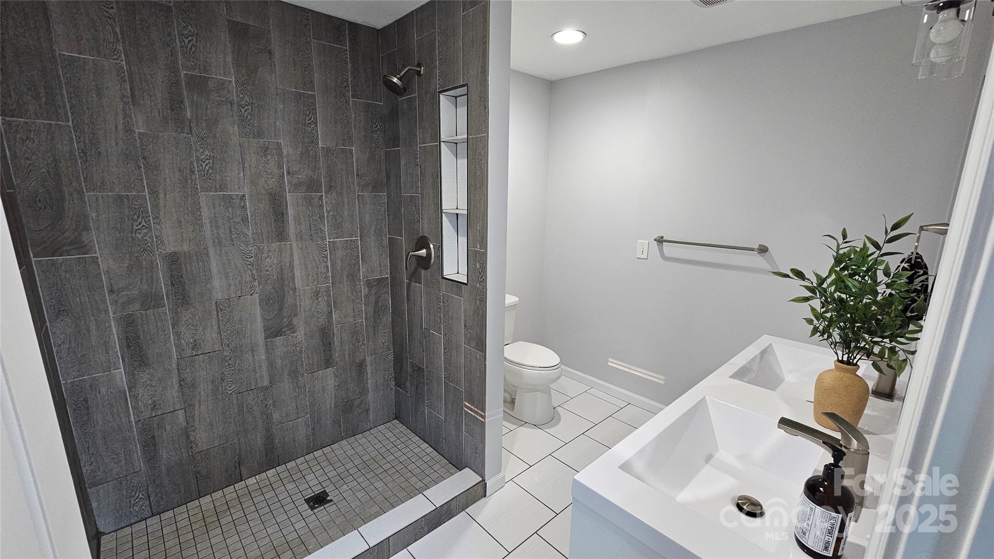 202 Williamson Street Fort Mill, SC 29715 - Photo 14 of 24 a bathroom with a shower and a sink