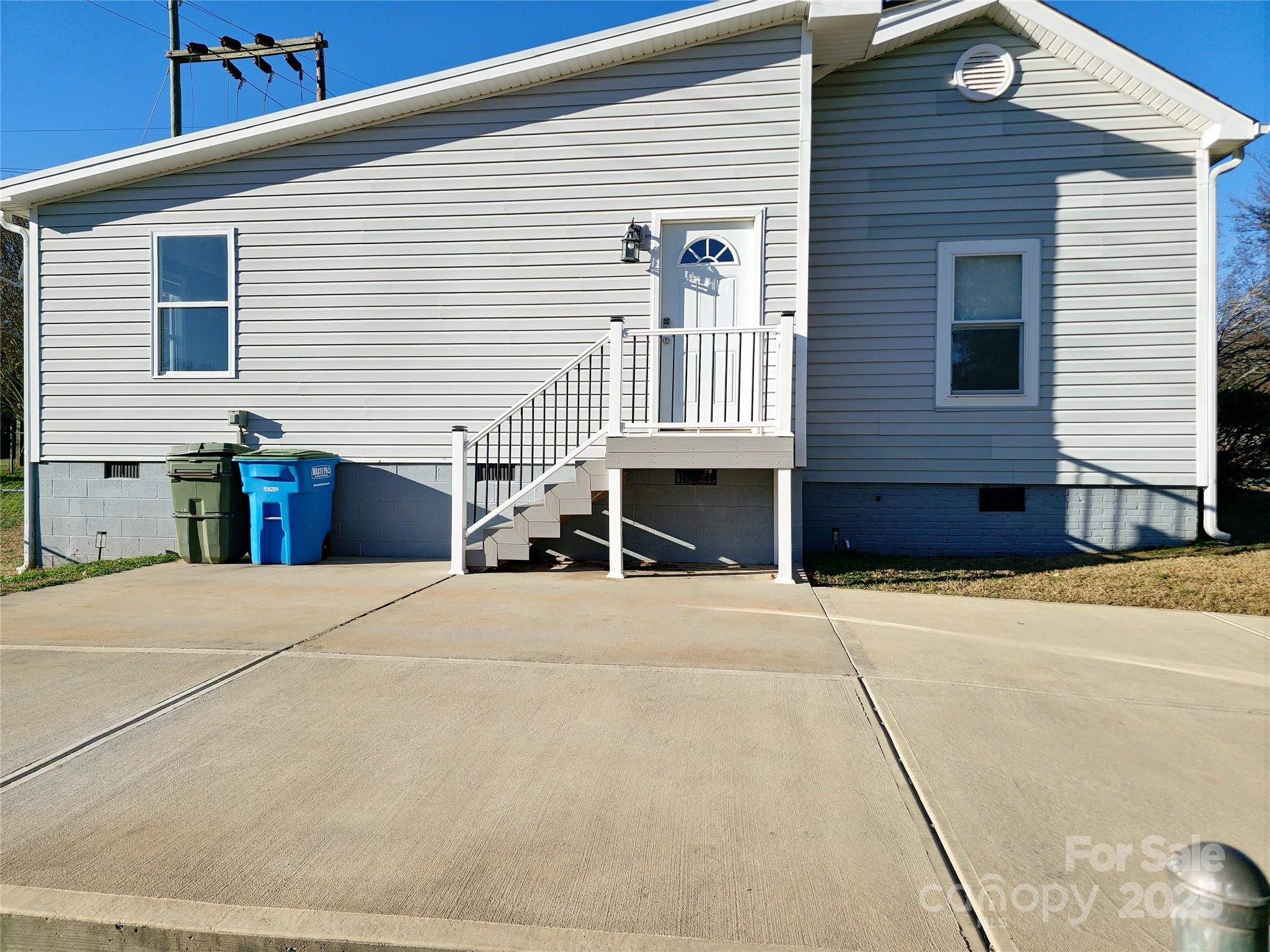 202 Williamson Street Fort Mill, SC 29715 - Photo 20 of 24 a front view of a house with a yard and garage