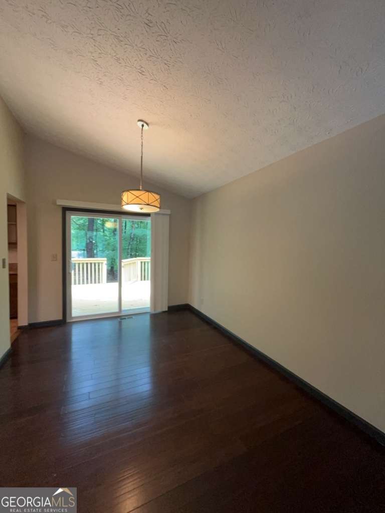 1265 Herrington Road Lawrenceville, GA 30044 - Photo 10 of 52 an empty room with wooden floor and windows