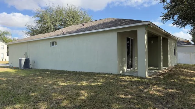 a view of a yard from a corridor