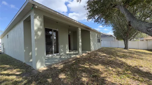 a view of a house with a snow in the yard