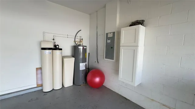 a kitchen with a sink appliances and cabinets
