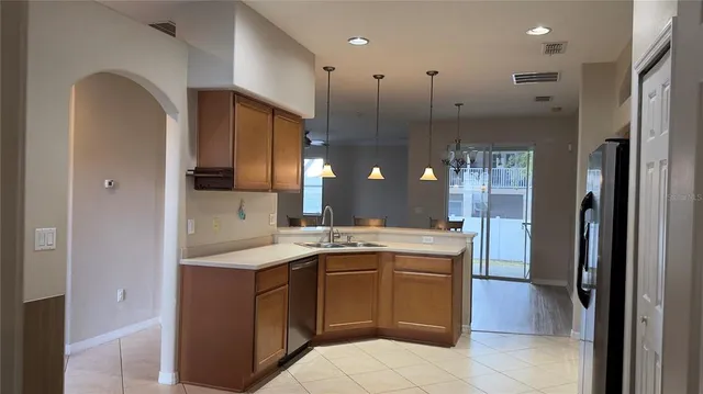 a view of a chandelier fan and windows