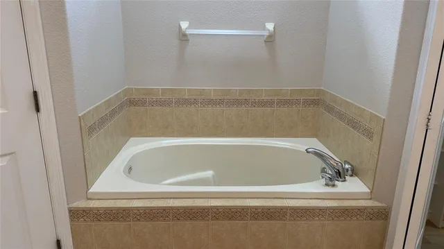 a view of a swimming pool with a yard