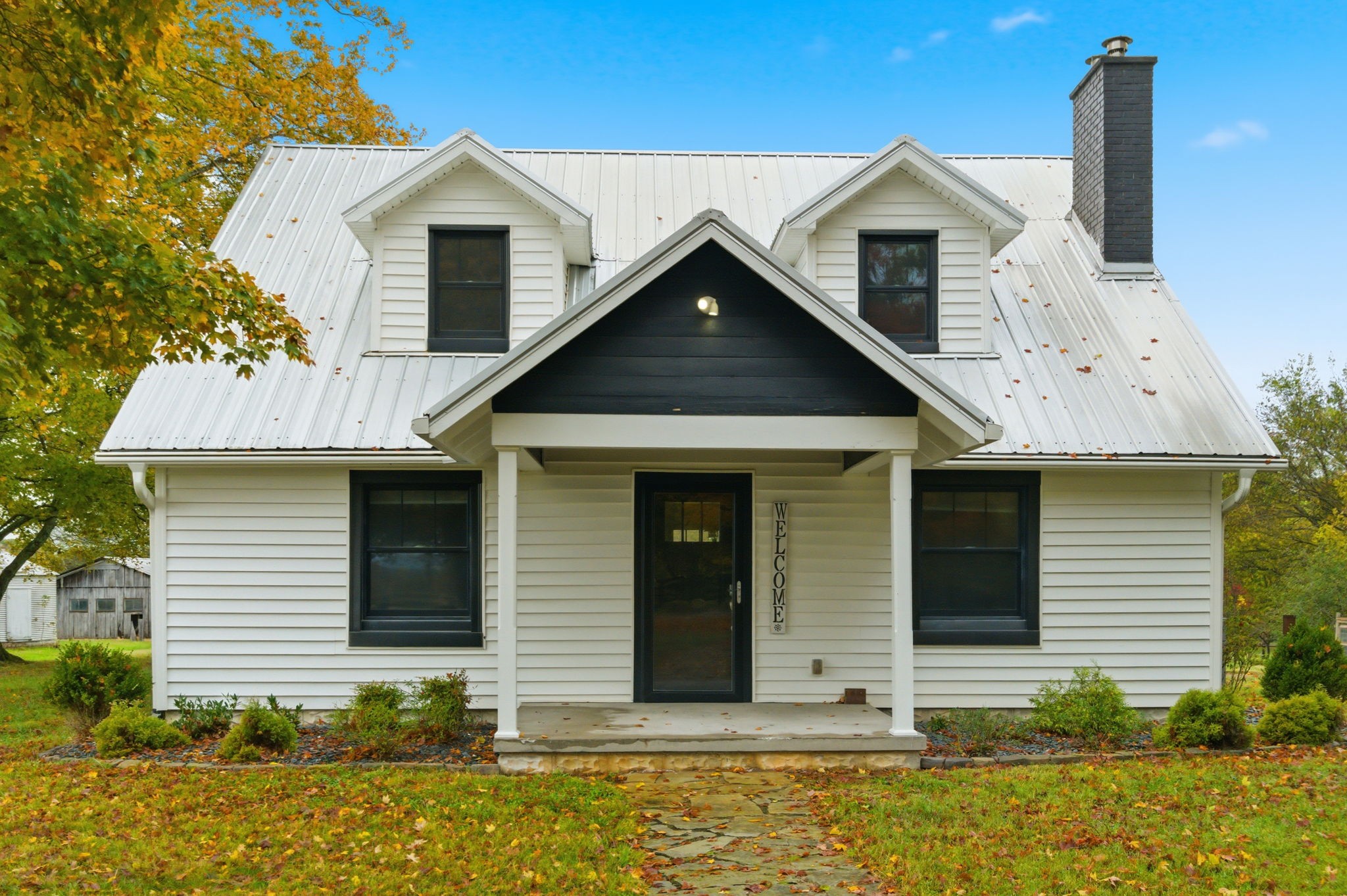 3863 Felts Road Cedar Hill, TN 37032 - Photo 1 of 32 a front view of a house with garden