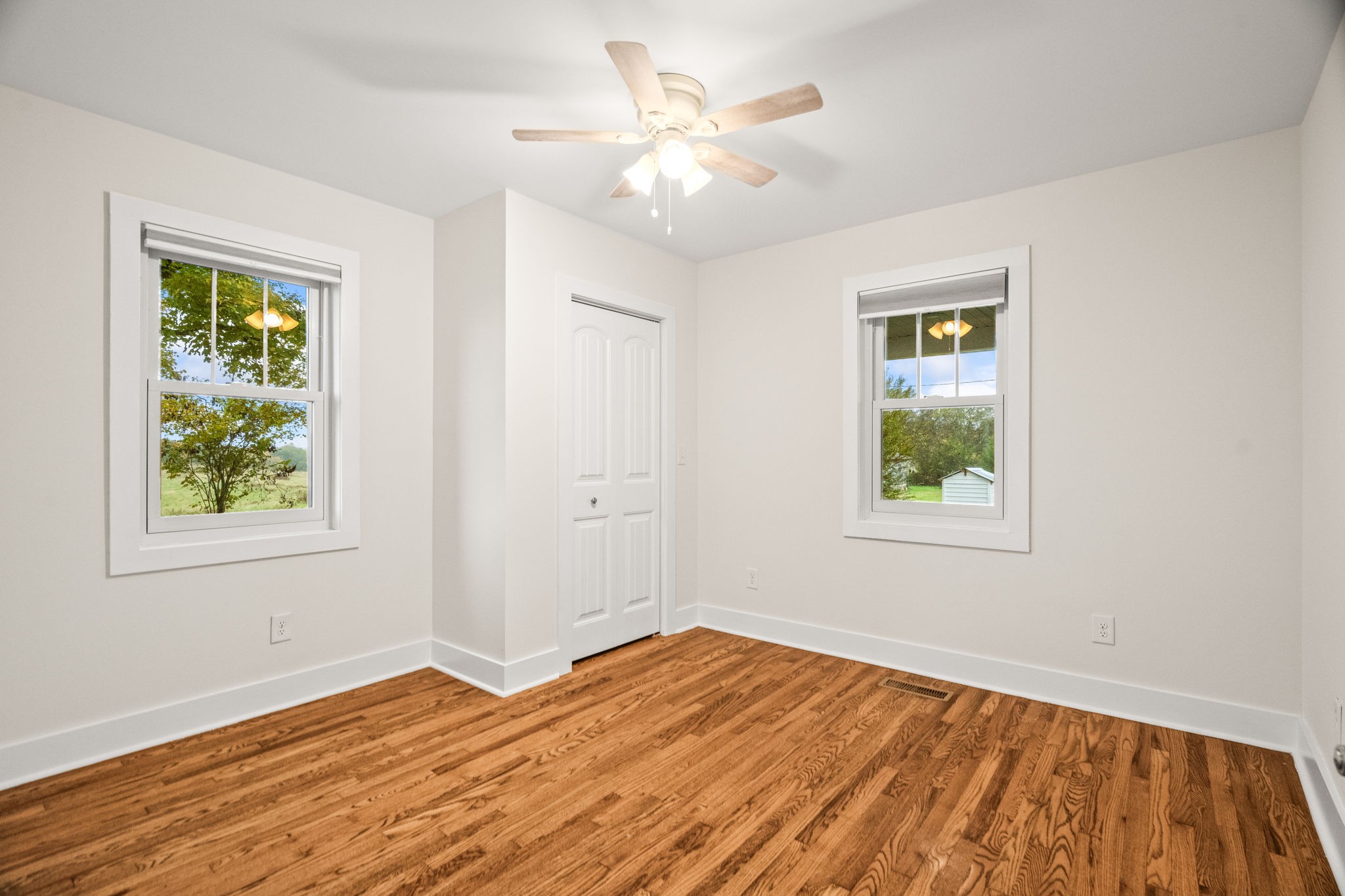 3863 Felts Road Cedar Hill, TN 37032 - Photo 11 of 32 a view of empty room with wooden floor and fan