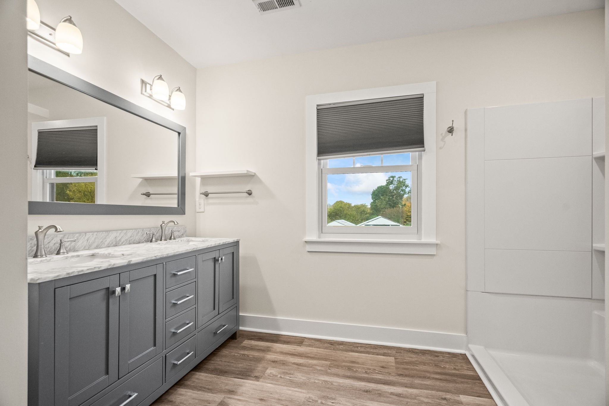 3863 Felts Road Cedar Hill, TN 37032 - Photo 13 of 32 a bathroom with a granite countertop sink mirror and a window