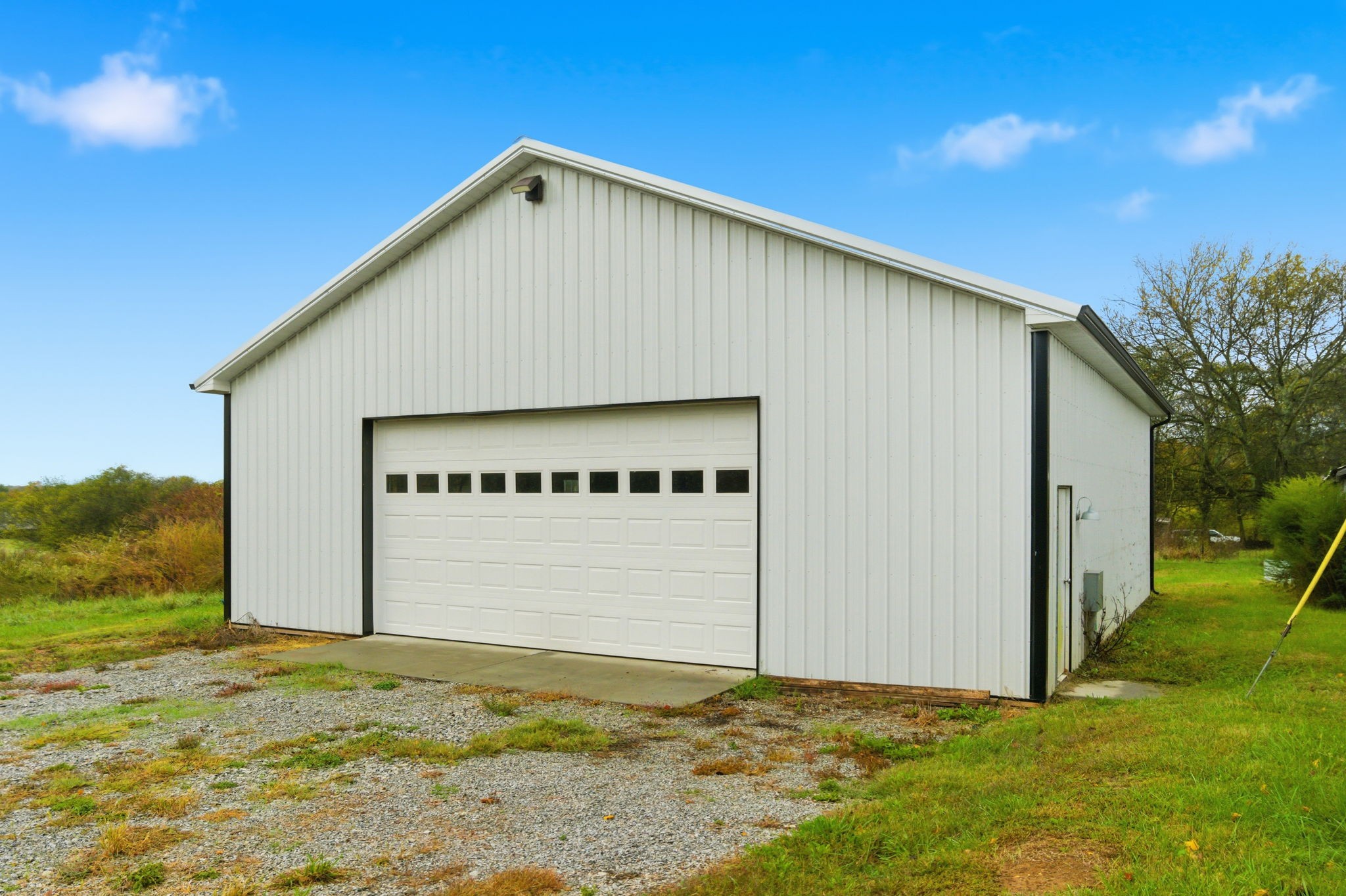 3863 Felts Road Cedar Hill, TN 37032 - Photo 19 of 32 a view of a house with backyard and garage
