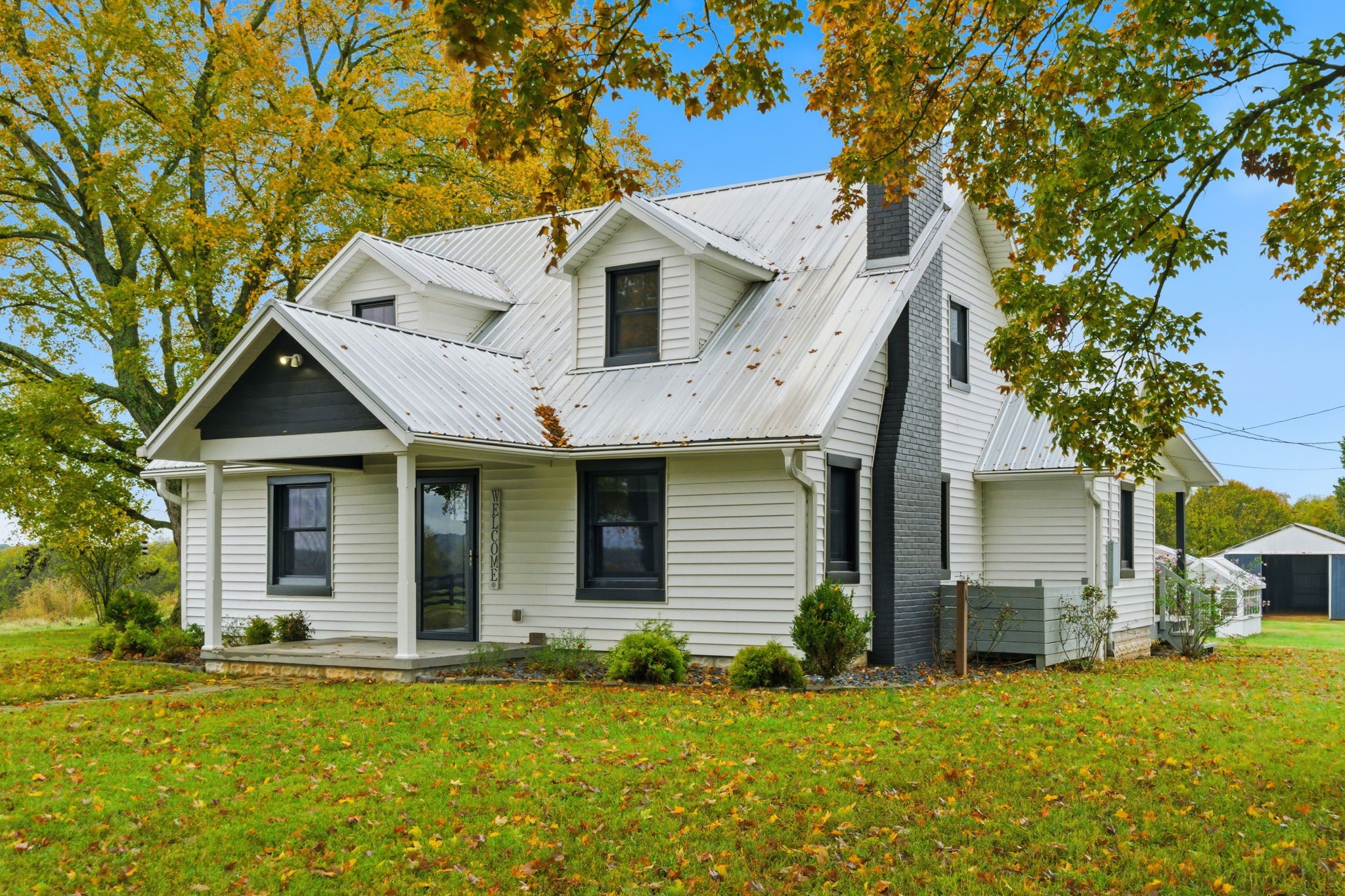 3863 Felts Road Cedar Hill, TN 37032 - Photo 2 of 32 a front view of a house with a yard