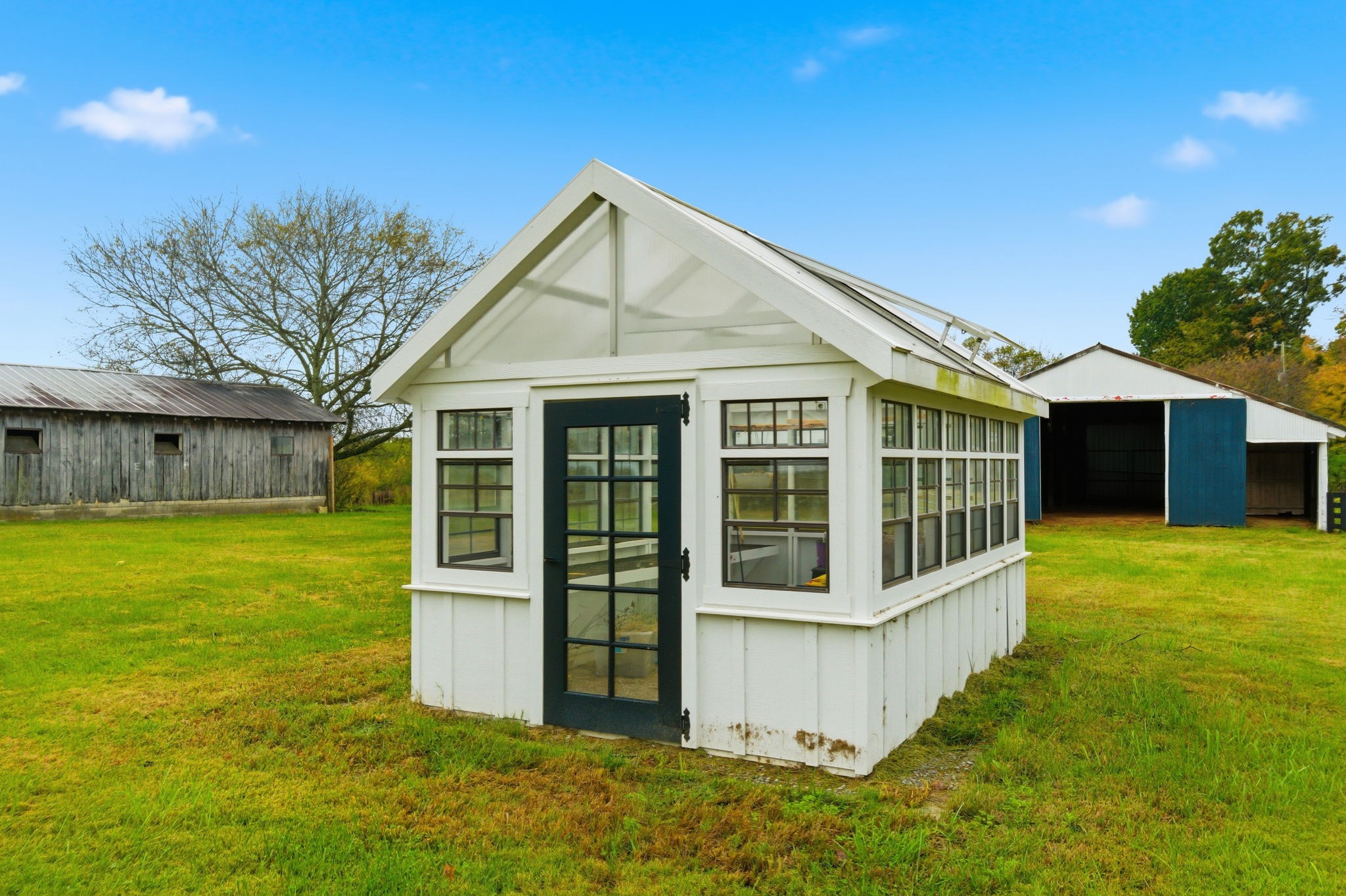 3863 Felts Road Cedar Hill, TN 37032 - Photo 21 of 32 a view of a house with backyard and garden
