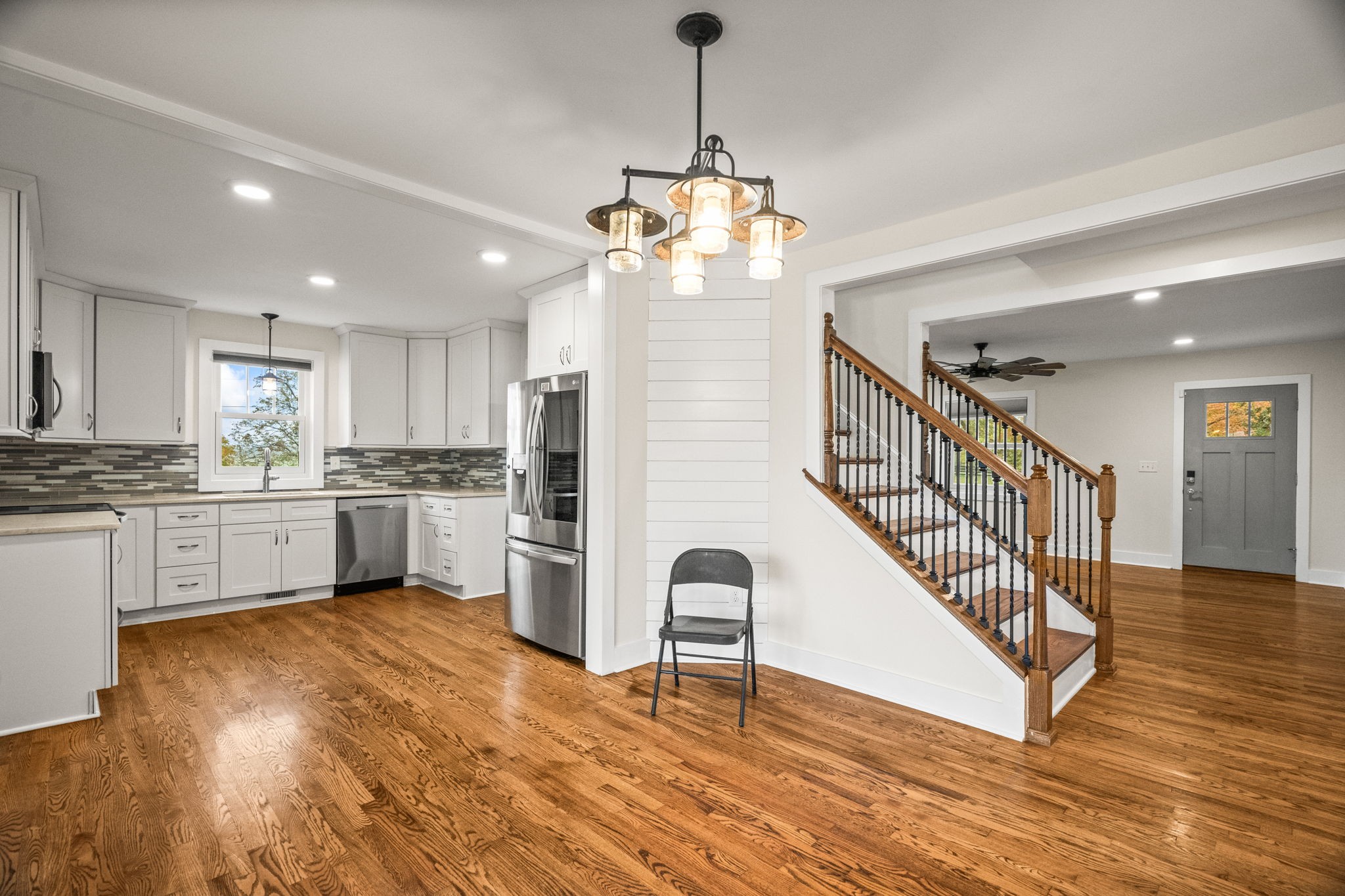 3863 Felts Road Cedar Hill, TN 37032 - Photo 7 of 32 a open kitchen with white cabinets wooden floor and stainless steel appliances