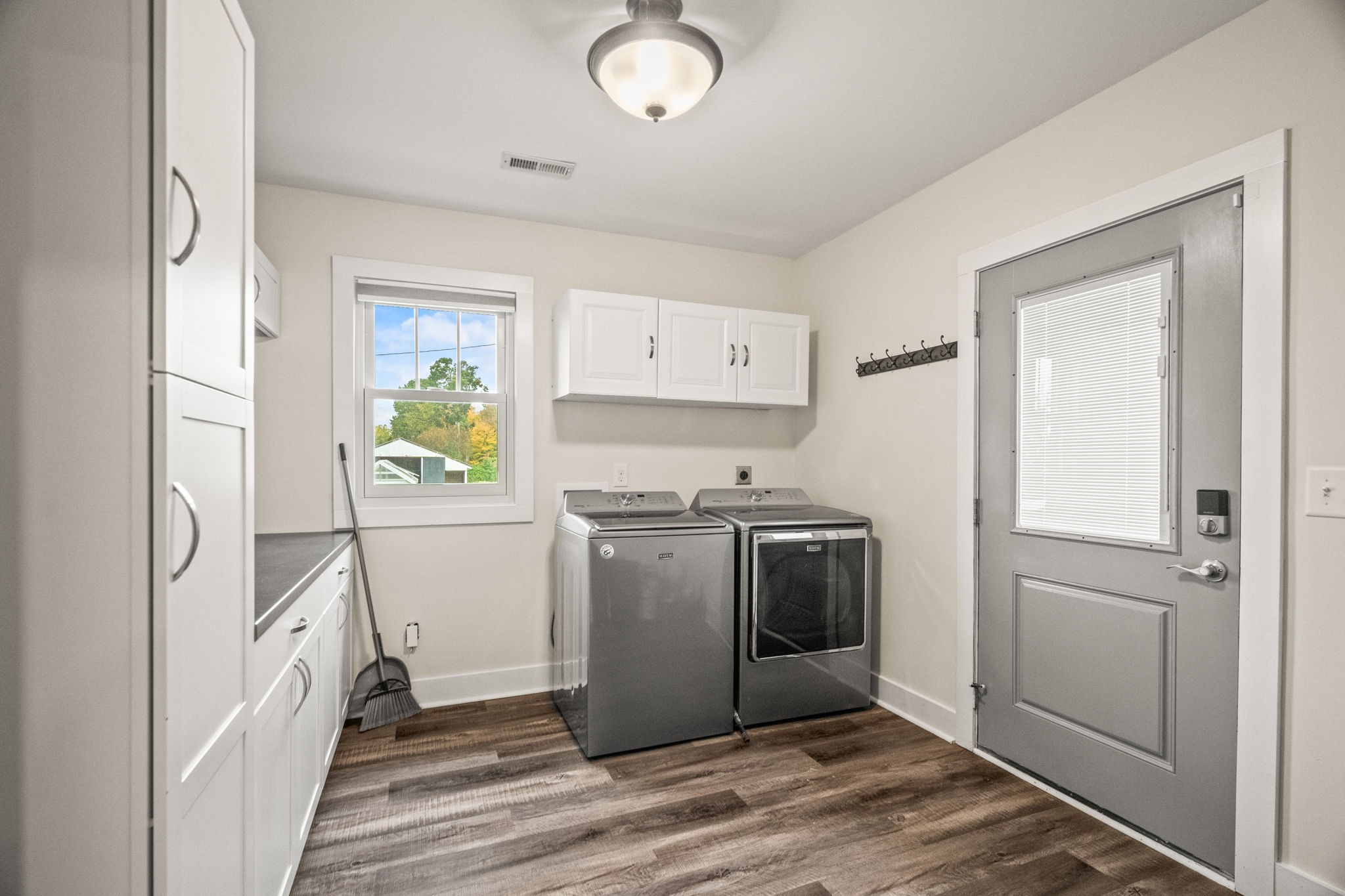 3863 Felts Road Cedar Hill, TN 37032 - Photo 9 of 32 a view of a kitchen with fridge and wooden floor