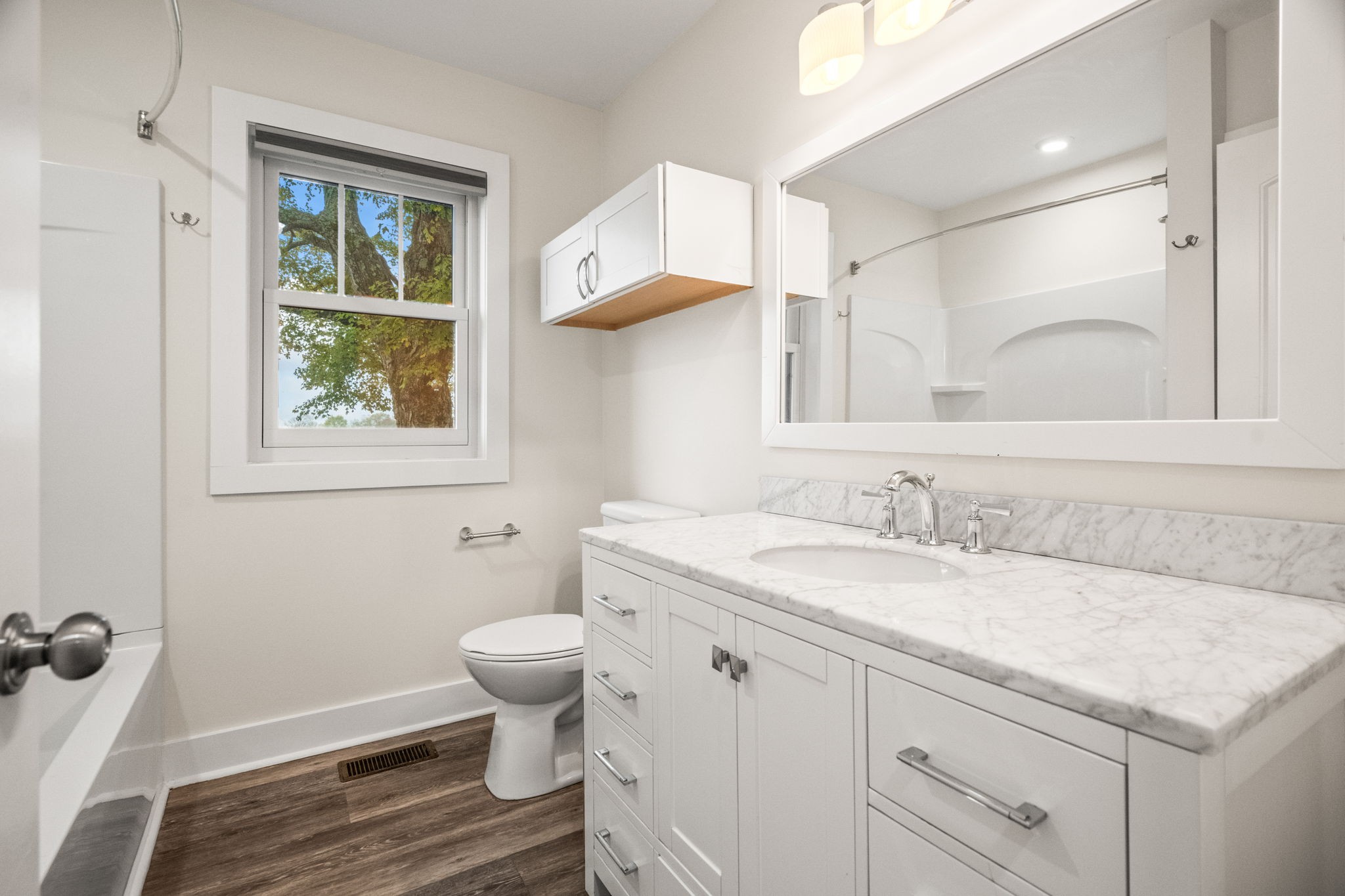 3863 Felts Road Cedar Hill, TN 37032 - Photo 10 of 32 a bathroom with a granite countertop sink toilet and a mirror